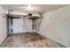 Clean, attached garage with white walls and concrete floor, ready for parking or storage at 500 Fulton St, Aurora, CO 80010