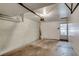 Spacious, attached garage with concrete floor, white walls, and access door to backyard at 500 Fulton St, Aurora, CO 80010
