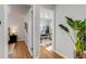 Bright hallway view of office space with hardwood floors, natural light and neutral color palette at 500 Fulton St, Aurora, CO 80010