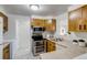 Efficient kitchen with stainless steel oven, classic cabinets and ample counter space at 500 Fulton St, Aurora, CO 80010