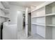 Well-organized laundry room with ample shelving and modern appliances for efficient chore management at 500 Fulton St, Aurora, CO 80010