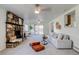 Bright living room features a stone fireplace and seamless access to the outdoor patio at 500 Fulton St, Aurora, CO 80010
