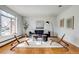 Bright living room with hardwood floors, modern furniture, and large windows for natural light at 500 Fulton St, Aurora, CO 80010
