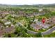 Aerial view of suburban neighborhood with mountain views, community walking paths, and home location pin at 5723 S Union Ct, Littleton, CO 80127