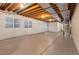 Unfinished basement, ready for customization with egress windows and drywall at 5723 S Union Ct, Littleton, CO 80127