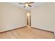 Bright, unfurnished bedroom with wood floors, vaulted ceilings, and a ceiling fan at 5723 S Union Ct, Littleton, CO 80127