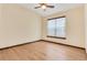Bright, unfurnished bedroom with wood floors, vaulted ceilings, and a ceiling fan at 5723 S Union Ct, Littleton, CO 80127