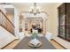 Spacious dining room provides clear views into the living room, fireplace, and kitchen at 5723 S Union Ct, Littleton, CO 80127