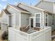 A well maintained home has a fenced-in porch with stair access to the front door at 5723 S Union Ct, Littleton, CO 80127