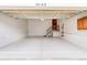Spacious garage with epoxy floors, stairs to the house, and ample space at 5723 S Union Ct, Littleton, CO 80127