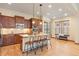 Modern kitchen with hardwood floors, a center island, pendant lighting, and stainless steel appliances at 5723 S Union Ct, Littleton, CO 80127