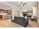 Inviting living area with a stone fireplace, hardwood floors, and an open layout to the kitchen at 5723 S Union Ct, Littleton, CO 80127