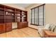 Spacious office with custom cabinets, desk, and shelving with large window at 5723 S Union Ct, Littleton, CO 80127