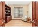 Bright office space featuring custom built-ins, natural light, and comfortable seating at 5723 S Union Ct, Littleton, CO 80127