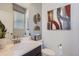 Elegant powder room featuring a modern vanity, decorative mirror, and stylish accents for a touch of sophistication at 14147 Bunny Hop Ln, Parker, CO 80134