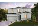 Charming two-story home featuring stone accents, a two car garage, and professionally landscaped front yard at 14147 Bunny Hop Ln, Parker, CO 80134