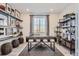 Inviting home office with a stylish desk, shelving, and natural light, creating a productive workspace at 14147 Bunny Hop Ln, Parker, CO 80134