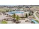 Aerial view showcases community pool, playground, and walking paths, highlighting recreational opportunities and neighborhood charm at 14582 Mission Walk Loop, Parker, CO 80134