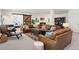 Spacious basement features a comfortable seating area, sliding barn door, and colorful rug at 14582 Mission Walk Loop, Parker, CO 80134
