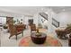Open basement area with a cozy seating arrangement, stairs, and an accent rug at 14582 Mission Walk Loop, Parker, CO 80134