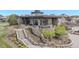 View of a modern clubhouse with outdoor seating area and stone accents at 14582 Mission Walk Loop, Parker, CO 80134