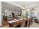 Dining area leads into kitchen with island and chairs with lots of natural light from the sliding glass doors at 14582 Mission Walk Loop, Parker, CO 80134