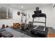 Home gym with treadmill, elliptical, rowing machine, and weights for fitness enthusiasts at 14582 Mission Walk Loop, Parker, CO 80134