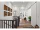 Open hallway showcasing hardwood floors, white walls, and stylish decor at 14582 Mission Walk Loop, Parker, CO 80134
