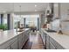 Bright kitchen featuring quartz countertops, stainless steel appliances, and plenty of counter space at 14582 Mission Walk Loop, Parker, CO 80134