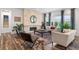 Spacious living room with a stone fireplace, hardwood floors, and large windows at 14582 Mission Walk Loop, Parker, CO 80134