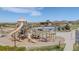 View of the community playground and pool area with slides and play structures at 14582 Mission Walk Loop, Parker, CO 80134