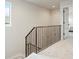 Hallway with carpeted flooring, iron railing and neutral color scheme at 2454 S Gilpin St, Denver, CO 80210