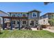 Backyard featuring a pergola covered seating area, outdoor kitchen and manicured lawn at 10694 Cedarcrest Cir, Highlands Ranch, CO 80130