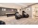 Carpeted basement with two reclining leather chairs, pool table and full bathroom off to the right at 10694 Cedarcrest Cir, Highlands Ranch, CO 80130