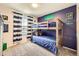 This comfy bedroom features a twin bunk bed, stylish wall decor, and a window with decorative striped curtains at 10694 Cedarcrest Cir, Highlands Ranch, CO 80130
