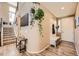 Bright foyer featuring hardwood floors, staircase, coat rack and tasteful decor at 10694 Cedarcrest Cir, Highlands Ranch, CO 80130