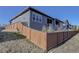 View of a fenced-in backyard and the rear of the house at 3961 Happy Hollow Dr, Castle Rock, CO 80104