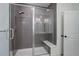 Contemporary bathroom with a glass shower, bench and modern fixtures at 3961 Happy Hollow Dr, Castle Rock, CO 80104