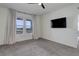 Bright bedroom features large windows with coverings, plush carpeting and wall-mounted TV hookups at 3961 Happy Hollow Dr, Castle Rock, CO 80104