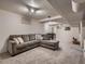 Spacious basement featuring cozy seating area, table, carpeted floors, and ample lighting at 7112 S Platte Canyon Dr, Littleton, CO 80128