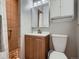 Bathroom featuring a new vanity, mirror and a walk-in shower at 7112 S Platte Canyon Dr, Littleton, CO 80128