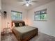Cozy bedroom featuring natural light from two windows at 7112 S Platte Canyon Dr, Littleton, CO 80128