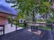Deck with dining table and umbrella overlooking the backyard at 7112 S Platte Canyon Dr, Littleton, CO 80128