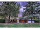 Charming single-story home with brick exterior and mature trees in a tranquil, landscaped setting at 7112 S Platte Canyon Dr, Littleton, CO 80128