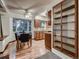 Sunny dining area adjacent to kitchen with ample natural light and traditional cabinetry at 7112 S Platte Canyon Dr, Littleton, CO 80128