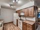 Traditional kitchen with white appliances and wooden cabinets at 7112 S Platte Canyon Dr, Littleton, CO 80128