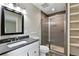 Updated bathroom featuring modern fixtures, a glass-enclosed shower, and a sleek vanity at 8056 Meadowdale Sq, Niwot, CO 80503