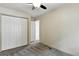 Bedroom featuring carpet, ceiling fan, and a closet with sliding doors at 8056 Meadowdale Sq, Niwot, CO 80503