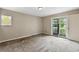Bright, spacious bedroom with carpeting and a sliding door leading to a private balcony at 8056 Meadowdale Sq, Niwot, CO 80503