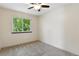 Bright bedroom featuring neutral walls, carpet flooring, ceiling fan, and a window at 8056 Meadowdale Sq, Niwot, CO 80503
